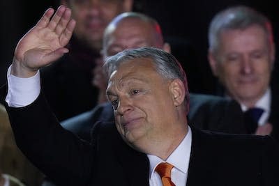 Hungary’s Prime Minister Viktor Orban greets cheering supporters during an election night rally in Budapest, Hungary in April 2022. (AP Photo/Petr David Josek)