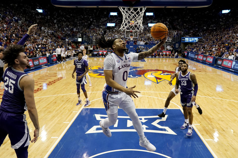 Kansas guard Bobby Pettiford Jr. (0) puts up a shot during the first half of an NCAA college basketball game against Kansas State Tuesday, Jan. 31, 2023, in Lawrence, Kan. (AP Photo/Charlie Riedel)