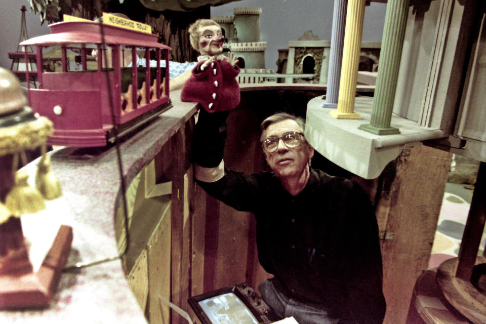 Fred Rogers works with Lady Elaine Fairchilde, one of the puppets featured in the Land of Make-believe, on his children's television program, "Mister Rogers' Neighborhood," in Pittsburgh on June 27, 1993. (AP Photo/Gene J. Puskar)