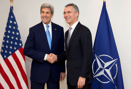 U.S. Secretary of State John Kerry and NATO Secretary-General Jens Stoltenberg (R) pose during a NATO foreign ministers meeting at the Alliance headquarters in Brussels, Belgium, December 6, 2016. REUTERS/Virginia Mayo/Pool