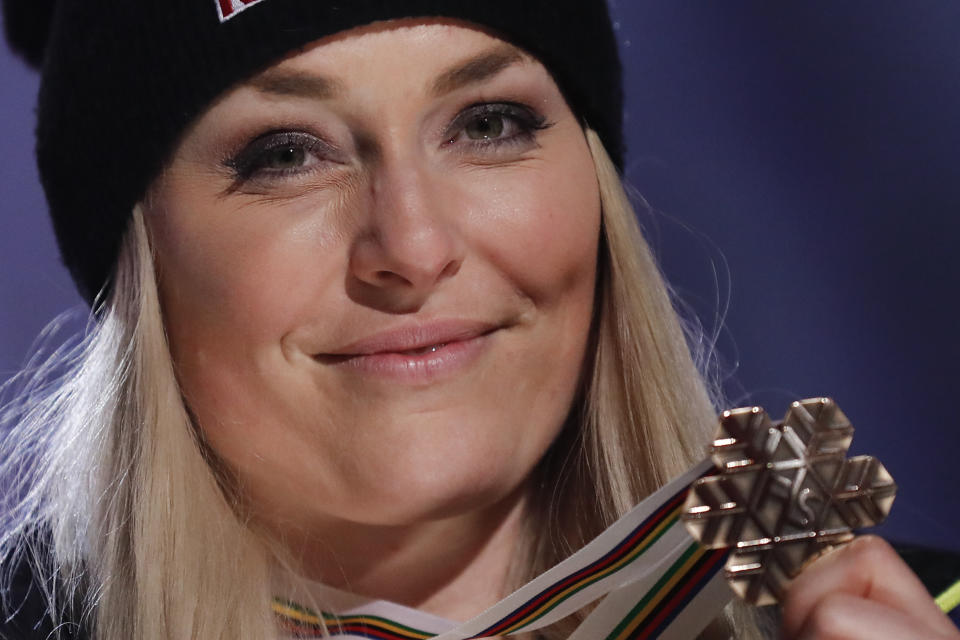 Third placed United States' Lindsey Vonn poses during the medal ceremony for the women's downhill race at the alpine ski World Championships in Are, Sweden, Sunday, Feb.10, 2019. (AP Photo/Gabriele Facciotti)