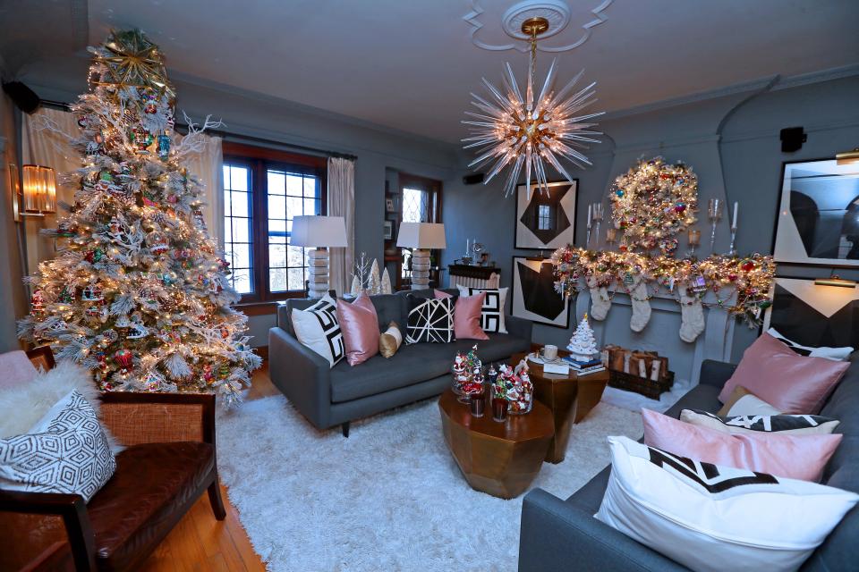 Mitchell Conklin's holiday decor is seen Nov. 29. Conklin, who owns  Luce Lighting & Luxuries, has a tall Christmas tree with coordinated garland on the mantel and a wreath over the fireplace.