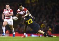 Britain Rugby Union - Wales v Japan - Principality Stadium, Cardiff, Wales - 19/11/16 Wales' Sam Davies tackles Japan's Akihito Yamada Reuters / Rebecca Naden Livepic