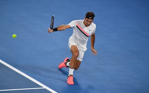 Switzerland's Roger Federer plays a return to Germany's Jan-Lennard Struff during their men's singles second round match on day four of the Australian Open tennis tournament in Melbourne on January 18, 2018 - Credit: AFP