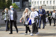 Relatives of Francis Quinn who was shot dead in the Ballymurphy shooting, arrive for the inquest into the shooting, in Belfast, Northern Ireland, Tuesday May 11, 2021. The findings of the inquest into the deaths of 10 people during an army operation in August 1971 is due to be published on Tuesday. (AP Photo/Peter Morrison)