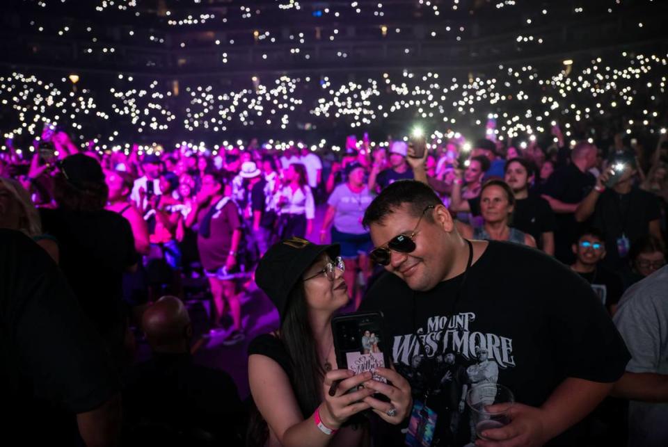 Sarah Mendoza, left, and Thomas Mendoza take a selfie between sets at Snoop Dogg’s High School Reunion Tour on Friday, Aug. 25, 2023, featuring Wiz Khalifa, Too $hort, Warren G, Berner and DJ Drama at Golden 1 Center in Sacramento.