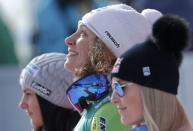 Alpine Skiing - FIS Alpine Skiing World Championships - Women's Downhill - St. Moritz, Switzerland - 12/2/17 - Gold medalist Ilka Stuhec of Slovenia is flanked by Austria's silver medalist Stephanie Venier (L) and bronze medalist Lindsey Vonn of the USA. REUTERS/Ruben Sprich