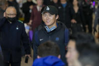 CORRECTS DATE - Los Angeles Dodgers pitcher Yoshinobu Yamamoto walks through a terminal during the baseball team's arrival at Incheon International Airport, Friday, March 15, 2024, in Incheon, South Korea, ahead of the team's baseball series against the San Diego Padres. (AP Photo/Lee Jin-man)