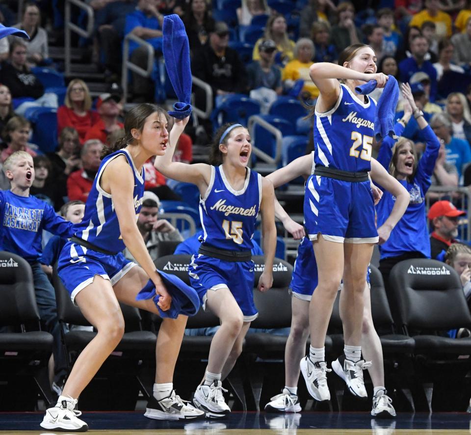 Nazareth's bench celebrates a point against Huckabay in the UIL Class 1A girls championship basketball game, Saturday, March 4, 2023, at the Alamodome in San Antonio. 