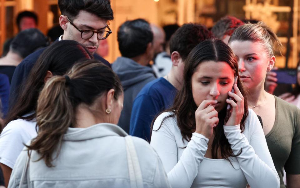 People react outside the Westfield Bondi Junction shopping mall