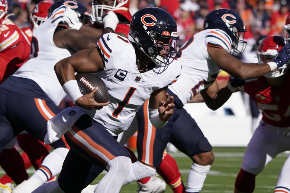 Chicago Bears quarterback Justin Fields runs with the ball during the first half of an NFL football game against the Kansas City Chiefs Sunday, Sept. 24, 2023, in Kansas City, Mo. (AP Photo/Ed Zurga)