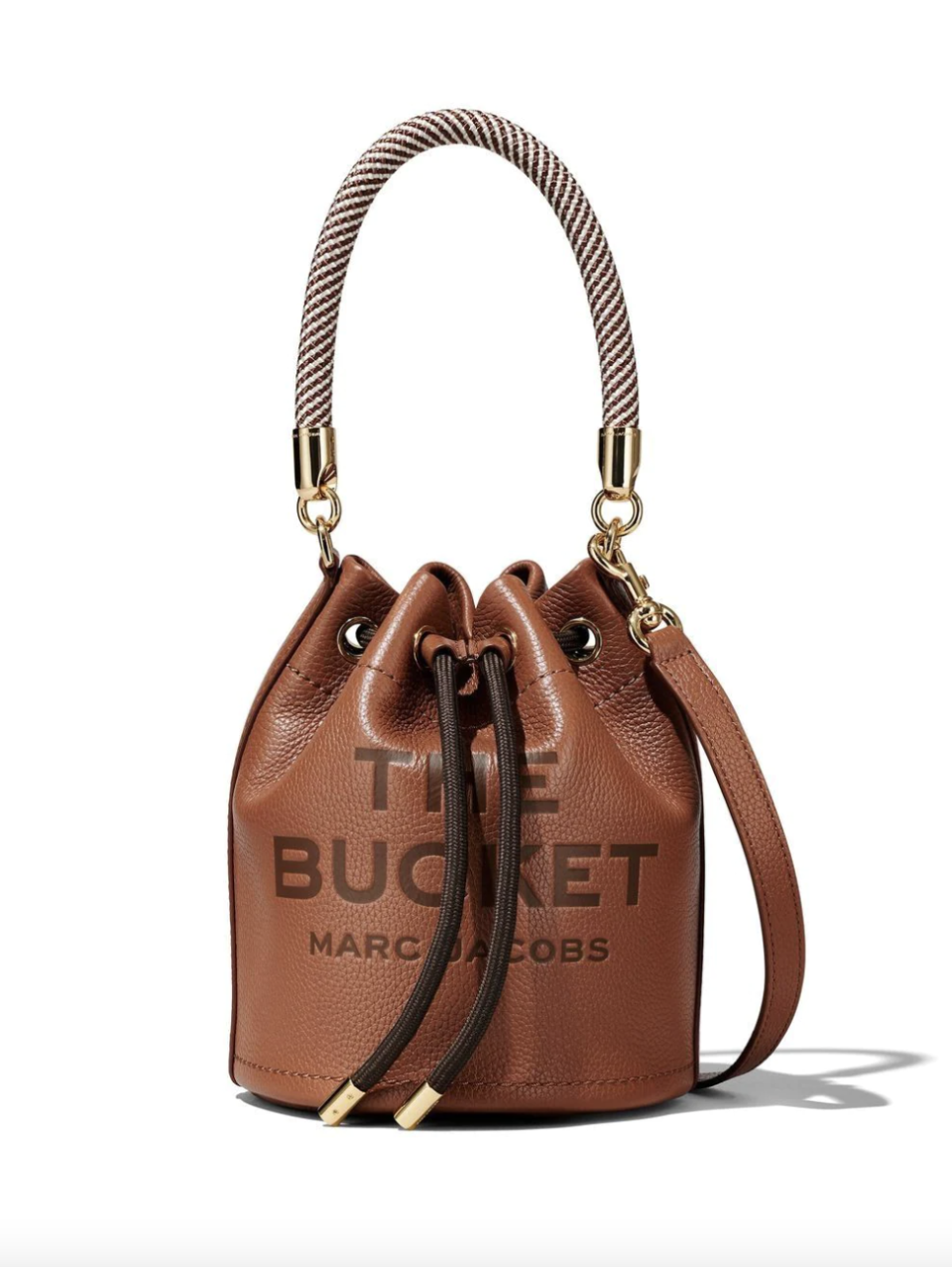 Marc Jacobs The Bucket Bag in brown leather on white background (Photo via Farfetch)