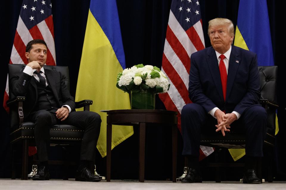 FILE In this file photo taken on Wednesday, Sept. 25, 2019, U.S. President Donald Trump meets with Ukrainian President Volodymyr Zelenskiy at the InterContinental Barclay New York hotel during the United Nations General Assembly, in New York. Ukraine's president sits down Monday, Dec. 9, 2019 for peace talks in Paris with Russian President Vladimir Putin in their first face-to-face meeting, and the stakes could not be higher. More than five years of fighting in eastern Ukraine between government troops and Moscow-backed separatists has killed more than 14,000 people, and a cease-fire has remained elusive. (AP Photo/Evan Vucci, File)