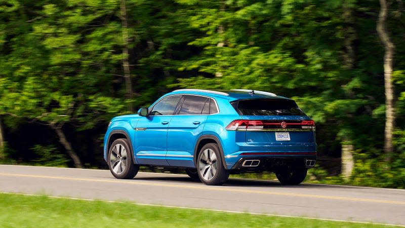 A photo of the VW Cross Sport driving on a country lane. 