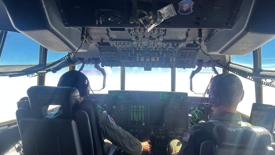 Pilots Lt. Col. Jesse Rosal, left, and Lt. Col. Stephen Pituch fly a WC-130J assigned to the Air Force Reserve's 53rd Weather Reconnaissance Squadron along the East Coast, April 24, 2024. (Courtney Mabeus-Brown/Air Force Times)