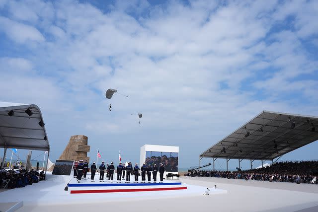 <p>Jordan Pettitt/WPA Pool/Shutterstock </p> Parachutists during the official international ceremony to mark the 80th anniversary of D-Day, at Omaha Beach in Normandy, France, on June 6, 2024