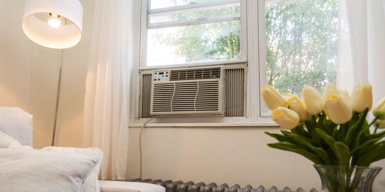 window air conditioner unit installed in an apartment