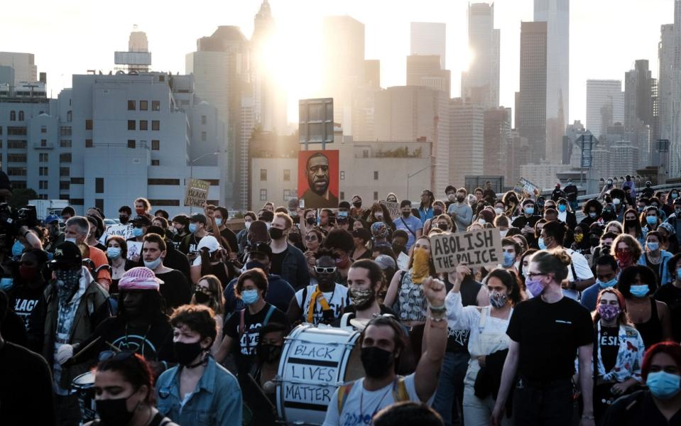 Black Lives Matter supporters and others march across the Brooklyn Bridge to honor George Floyd on the one year anniversary of his death on May 25, 2021 - Spencer Platt /Getty Images North America 