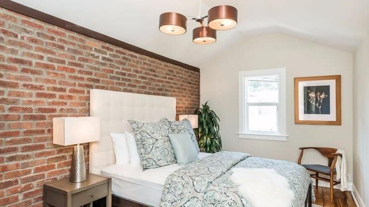 Bedroom with Decorative Brick Wall