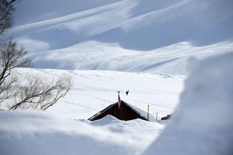 A home is buried along McGee Creek Road south of Mammoth Lakes.