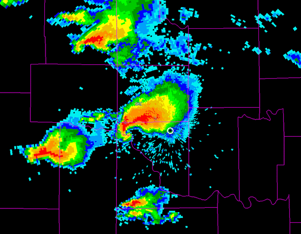 A radar image shows a storm cell with a hook behind it indicating the possibility of a tornado forming.