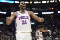 Philadelphia 76ers center Joel Embiid (21) celebrates as the team pulls ahead of the Miami Heat during the last minute of the second half of an NBA basketball game, Thursday, April 4, 2024, in Miami. The 76ers defeated the Heat 109-105. (AP Photo/Marta Lavandier)
