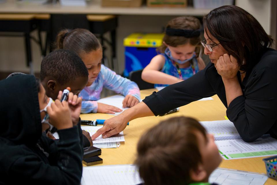 Teacher Najla Khalifeh leads a group through an activity during an intensive reading class at Freedom Elementary School in Buckeye, Arizona, on Nov. 16, 2021.