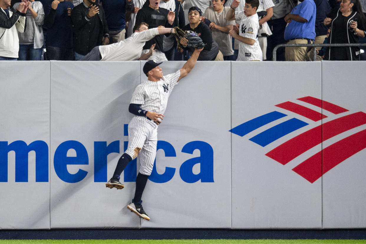 Two fans got a little too close for comfort on a crucial home run. (Getty Images)