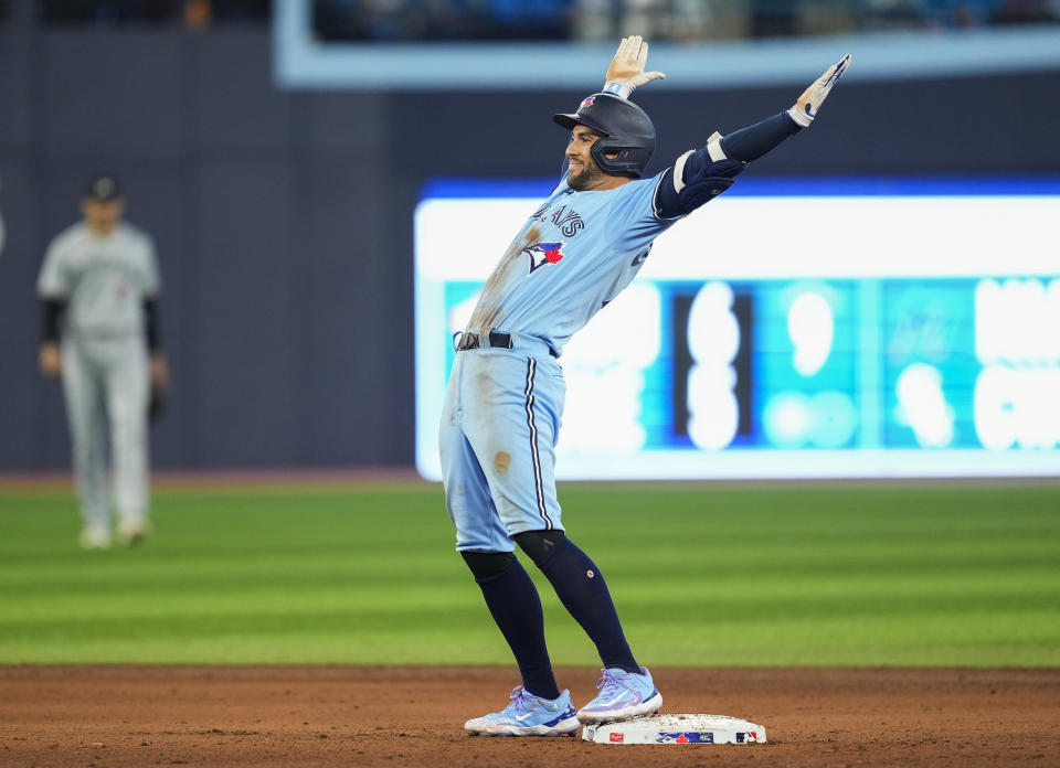 Toronto Blue Jays' George Springer celebrates a double against the Minnesota Twins during the ninth inning of a baseball game Friday, June 9, 2023, in Toronto. (Mark Blinch/The Canadian Press via AP)
