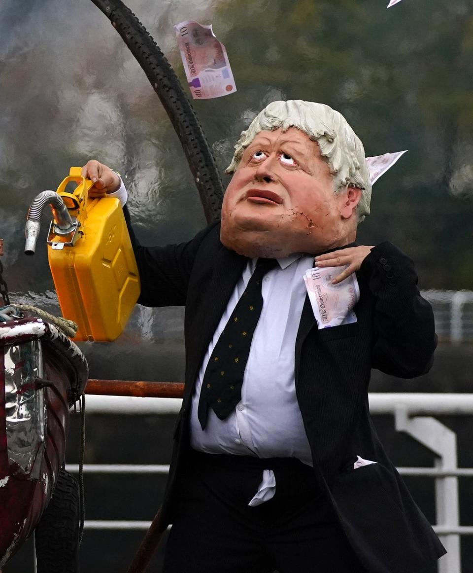 One protester was dressed up as Boris Johnson for the stunt (Andrew Milligan/PA) (PA Wire)
