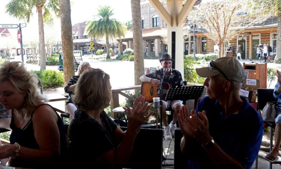 A musician plays to a crowd at Brownwood Paddock Square in The Villages in March.