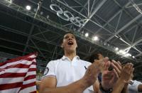 Mark Lopez cheers on his brother Steven Lopez (USA) of USA (not pictured). REUTERS/Issei Kato