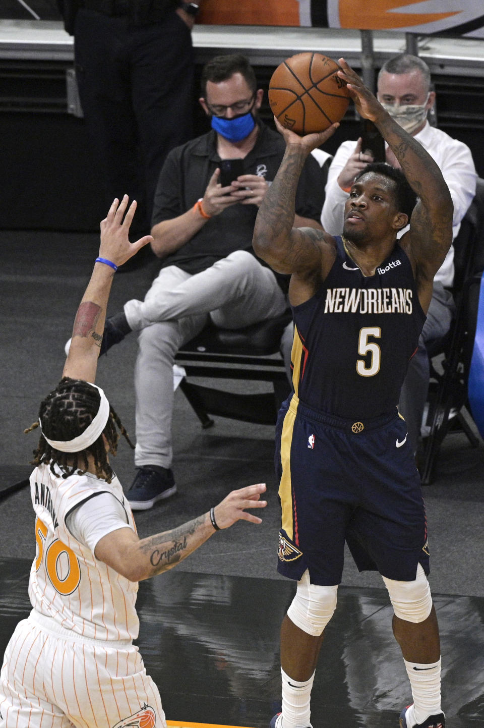New Orleans Pelicans guard Eric Bledsoe (5) goes up for a shot in front of Orlando Magic guard Cole Anthony (50) during the second half of an NBA basketball game Thursday, April 22, 2021, in Orlando, Fla. (AP Photo/Phelan M. Ebenhack)