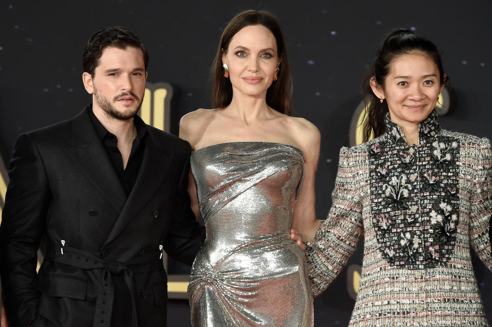 Actors Kit Harington (Luis Vuitton dress) and Angelina Jolie (Versace dress) with filmmaker Chloé Zhao (Chanel dress) at Rome Film Fest 2021. Eternals Red Carpet. Rome (Italy), October 24th, 2021 (Photo by Marilla Sicilia/Archivio Marilla Sicilia/Mondadori Portfolio via Getty Images)