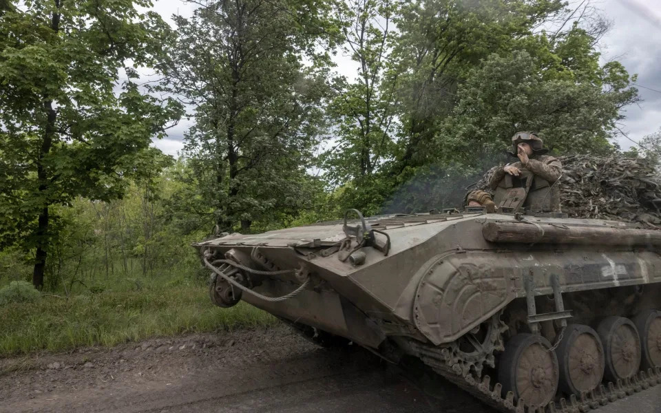 A BMP-2 drives along a road in the Bakhmut area - Heathcliff O'Malley