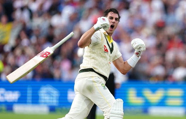 Pat Cummins celebrates hitting the winning runs 