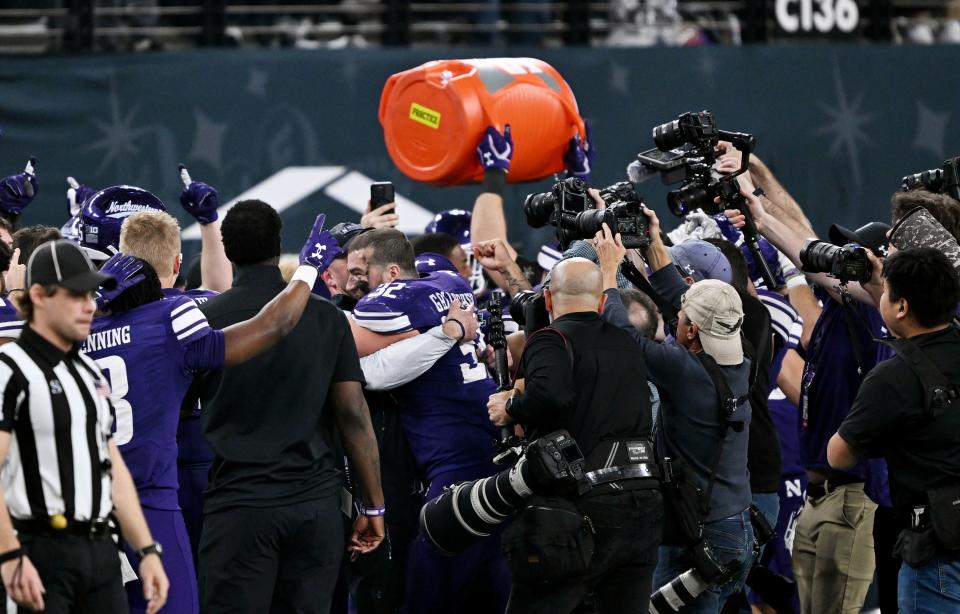 Northwestern Wildcats players celebrate their win over Utah in the SRS Distribution Las Vegas Bowl at Allegiant Stadium on Saturday, Dec. 23, 2023. Northwestern won 14-7. | Scott G Winterton, Deseret News