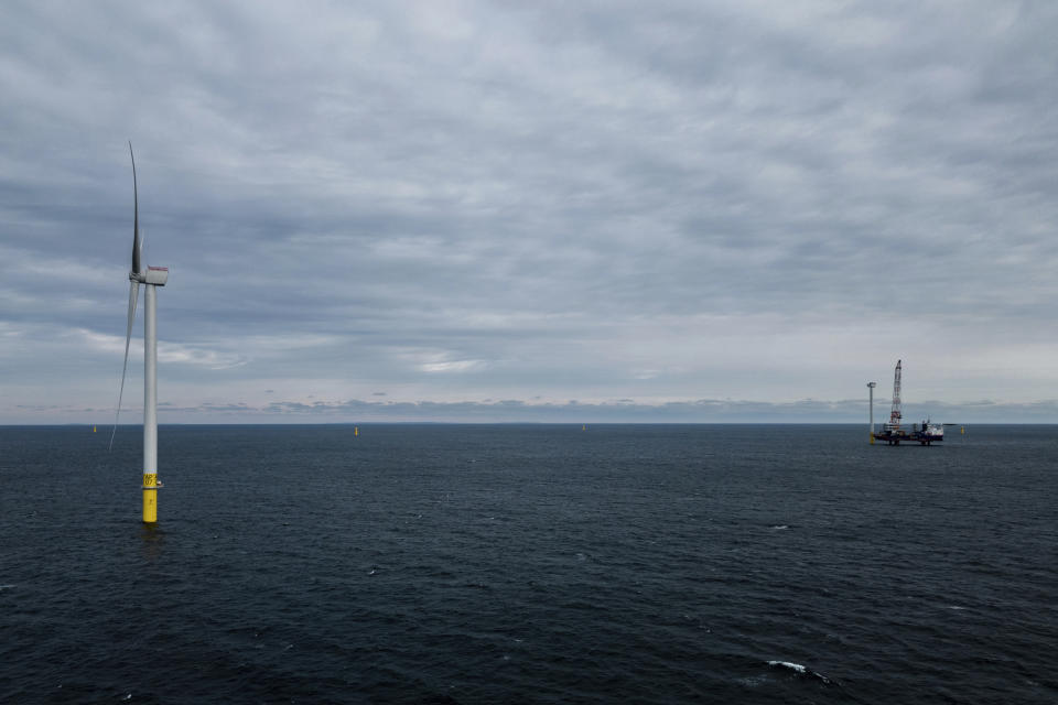 The first operating South Fork Wind farm turbine, Thursday, Dec. 7, 2023, 35 miles east of Montauk Point, N.Y. The turbine at the commercial-scale offshore wind farm is producing power for the U.S. electric grid for the first time. (AP Photo/Julia Nikhinson)