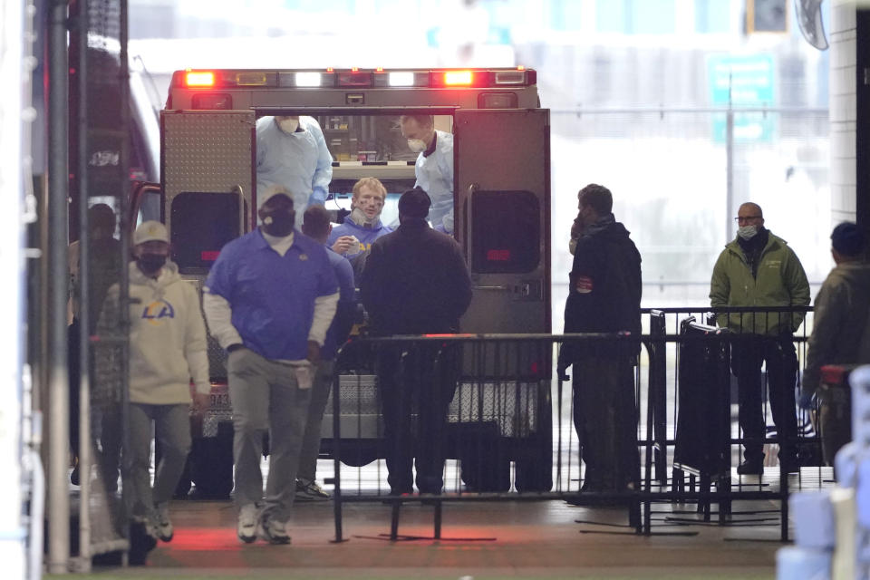 Los Angeles Rams quarterback John Wolford sits back after walking into an ambulance parked in a tunnel just off the field after being injured during the first half of an NFL wild-card playoff football game against the Seattle Seahawks, Saturday, Jan. 9, 2021, in Seattle. (AP Photo/Ted S. Warren)