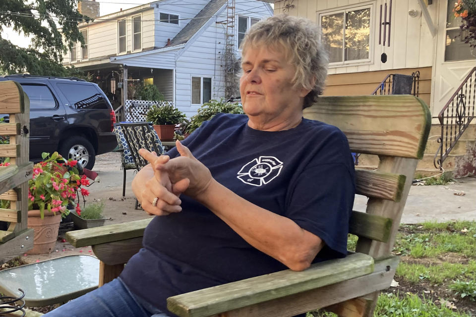 In her backyard in politically competitive Columbia County, Wisconsin, Mary Percifield talks on Sept. 13, 2022 in Pardeeville, Wis. Percifield worries the June U.S. Supreme Court decision overturning Roe v. Wade puts other federally protected rights at risk. The 68-year-old customer service representative is among independent voters nationally who have drifted toward supporting Democrats in November in light of the court decision and mixed messaging from Republicans over the summer. (AP Photo/Thomas Beaumont)