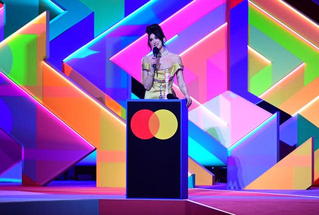 Dua Lipa accepts the award for Best Album (Ian West/PA)