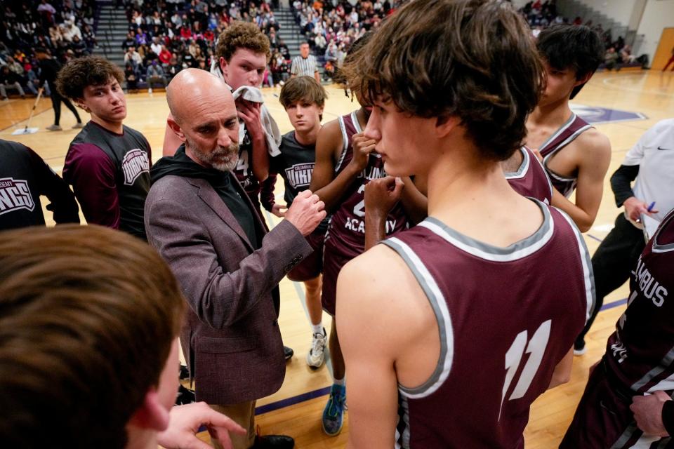Columbus Academy boys basketball coach Jeff Warstler speaks with his team during a Division III district final last season.