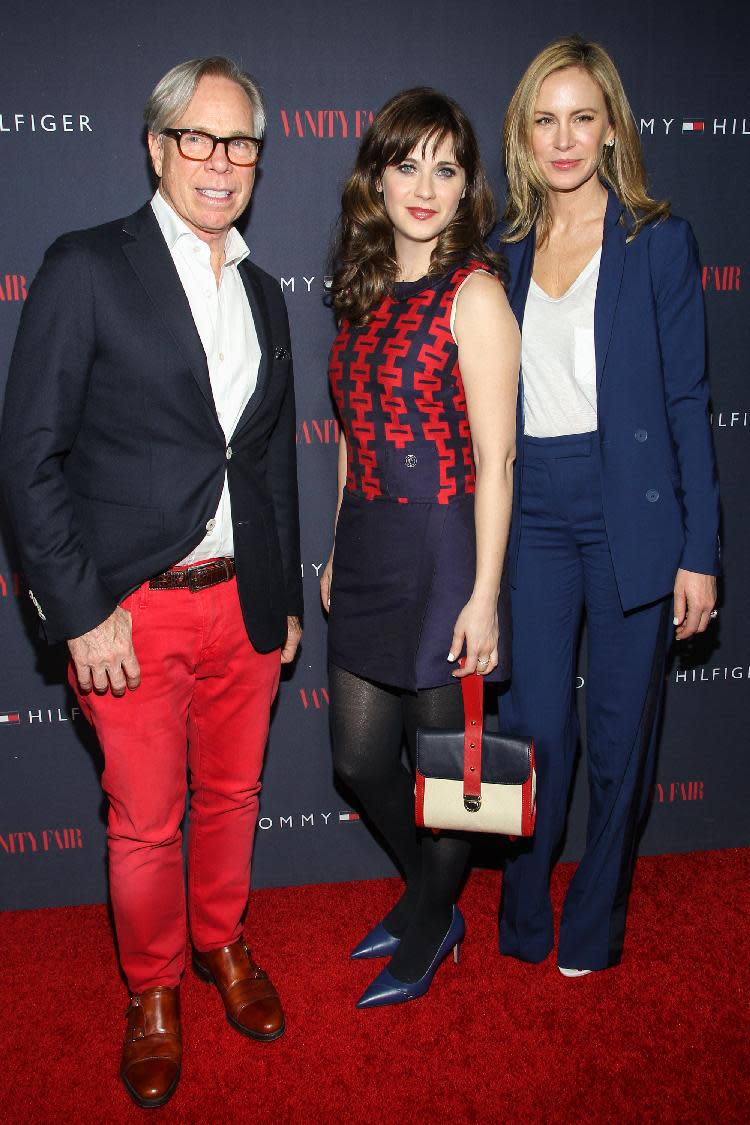 From left, Tommy Hilfiger, Zooey Deschanel and Dee Hilfiger attend the Zooey Deschanel for Tommy Hilfiger Collection launch event at The London Hotel on April 9, 2014 in West Hollywood, California. (Photo by Paul A. Hebert/Invision/AP)