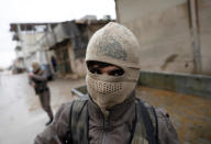 <p>Members of Turkey-backed Free Syrian Army police forces patrol in Azaz, Syria, Jan. 26, 2018. (Photo: Umit Bektas/Reuters) </p>