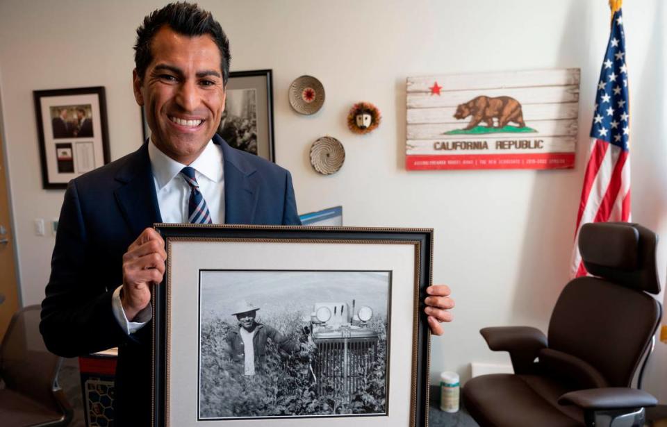 Assemblyman Robert Rivas holds a photo of his grandfather, Servando Flores, who worked with Cesar Chavez and the UFW as a leader in the fight to win equal rights for farmworkers. Rivas will become the new Speaker of the California State Assembly on June 30. Lezlie Sterling/lsterling@sacbee.com