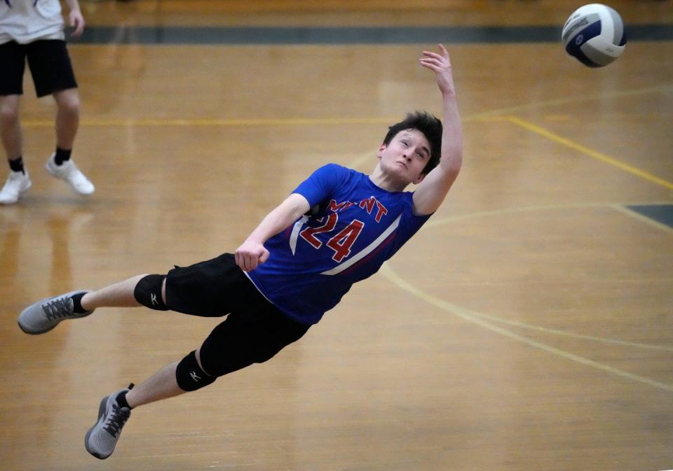 Mount St. Charles/N. Smithfield libero, Ben Sousa dives for the Mounties during Game 3 of their 3-0 win against Cranston East last season at Cranston.