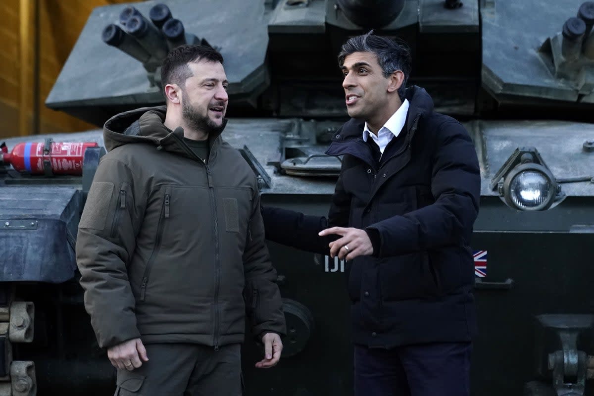 Prime minister Rishi Sunak and Ukrainian president Volodymyr Zelensky meet Ukrainian troops being trained to command Challenger 2 tanks at a military facility in Lulworth, Dorset (PA)