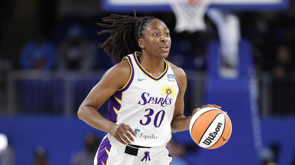 Los Angeles Sparks forward Nneka Ogwumike brings the ball up court against the Chicago Sky during the first half of the WNBA basketball game, Friday, May 6, 2022, in Chicago. (AP Photo/Kamil Krzaczynski)