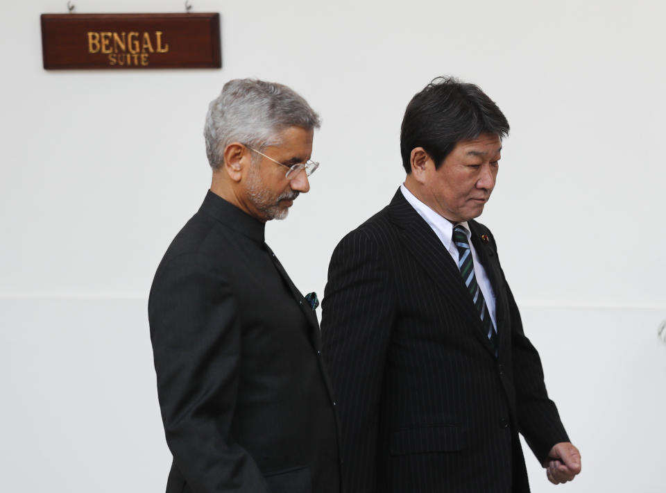 Indian Foreign Minister S. Jaishankar, left, arrives with his Japanese counterpart Toshimitsu Motegi before the start of India Japan 2+2 talks in New Delhi, India, Saturday, Nov. 30, 2019, to boost bilateral security and Defence cooperation between the two countries. (AP Photo/Manish Swarup)