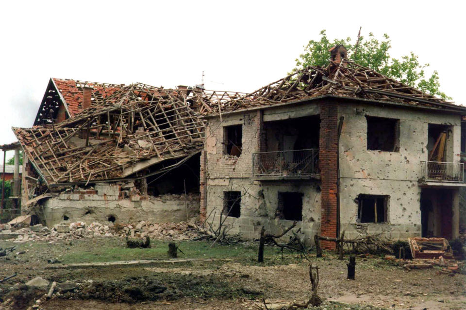 FILE - A destroyed house is deserted after NATO missiles reportedly strayed into a residential area of Nis, 200 kilometers (120 kilometers) south of Belgrade, around noon on May 7, 1999. Well before Russian tanks and troops rolled into Ukraine, Vladimir Putin was using the bloody breakup of Yugoslavia in the 1990s to ostensibly offer justification for the invasion of a sovereign European country. The Russian president has been particularly focused on NATO’s bombardment of Serbia in 1999 and the West’s acceptance of Kosovo’s declaration of independence in 2008. He claims both created an illegal precedent that shattered international law and order, apparently giving him an excuse to invade Ukraine. (AP Photo, File)
